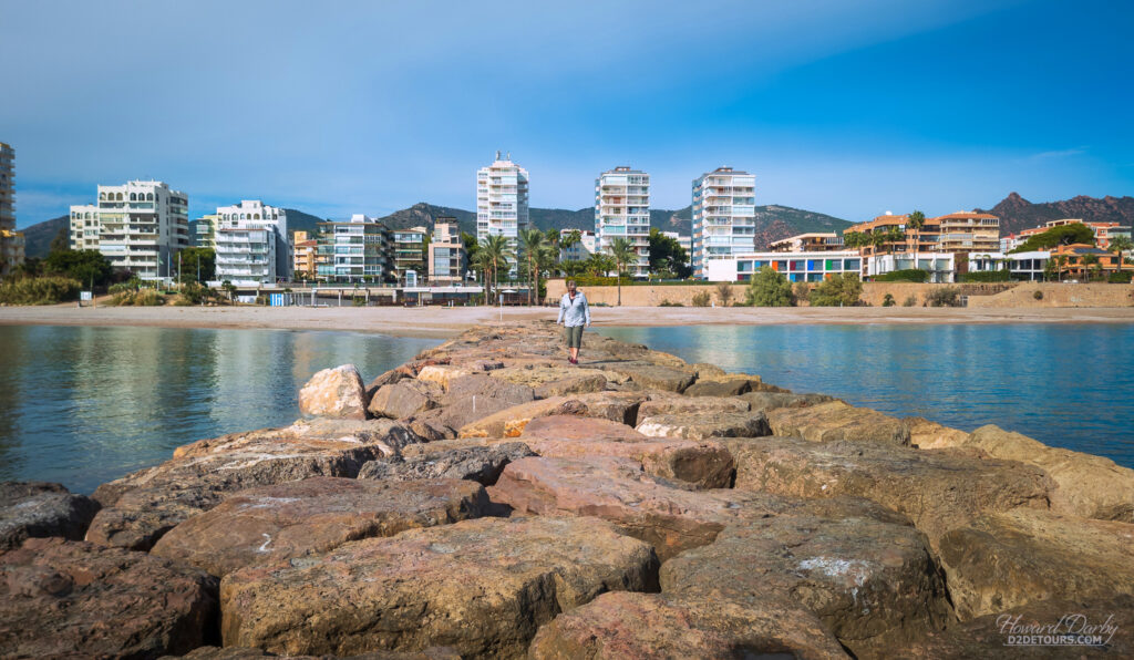 Walking along a breakwater on Benicassim's waterfront