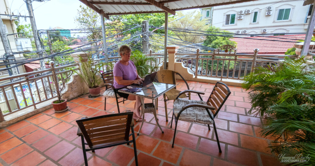 Working on the blog on the balcony of our Airbnb