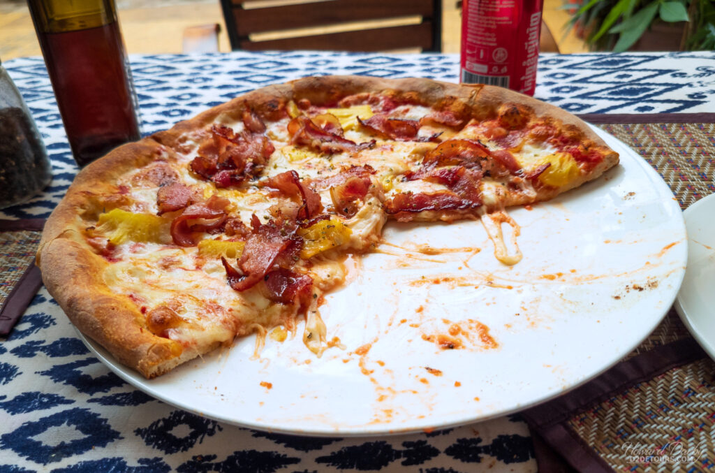 Half of our Hawaiian pizza already gobbled down at Dany’s Pizzeria