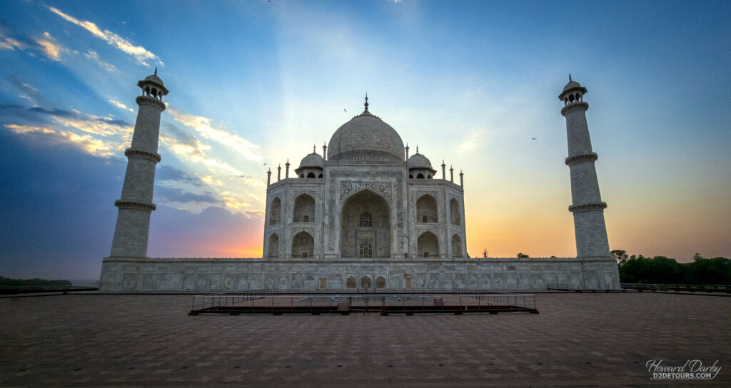 Sun rising behind the Taj Mahal