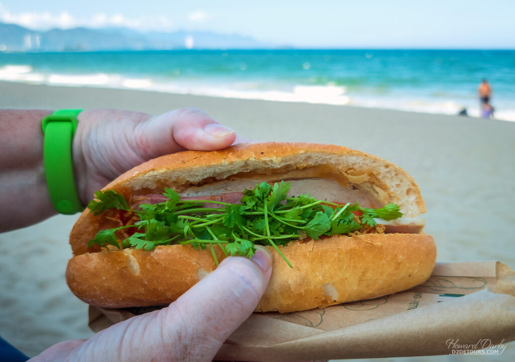 Having a Banh Mi on the boardwalk - a Vietnamese sub sandwich on a small baguette