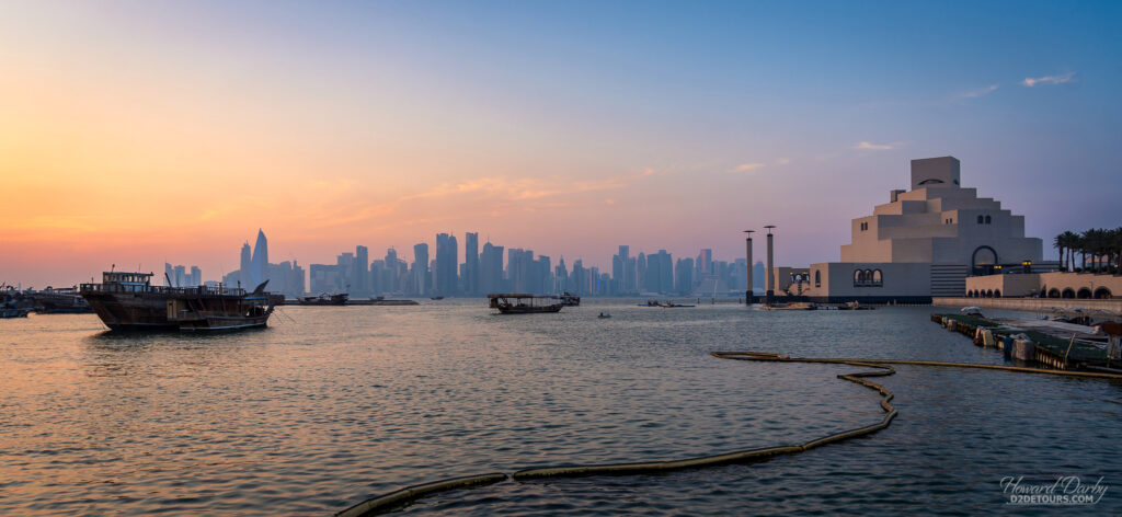 Museum of Islamic Art on the right, and view across Doha Bay during sunset