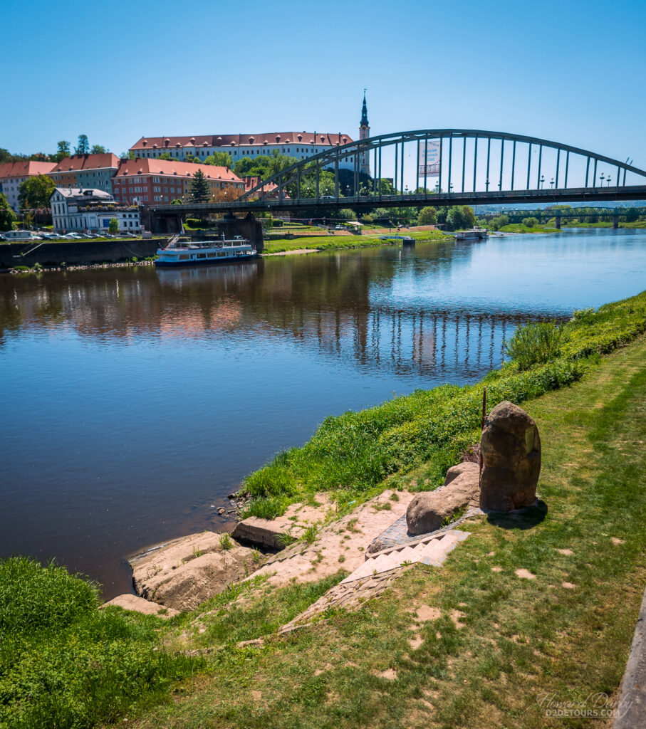 The city of Děčín where a Hunger Stone is embedded in the bank of the Elbe River (seen at the bottom of the picture)