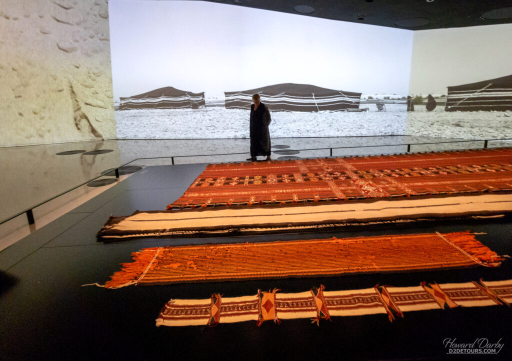 Whitney admiring a display of materials used by the nomadic tribes of Qatar