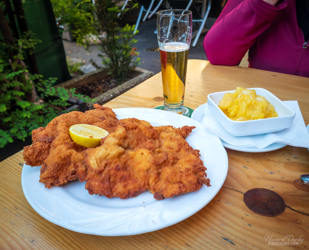 A pair of Wiener Schnitzel with a side of potato salad and beer - pretty much a mandatory dish when in Vienna, with the recipe and cooking style controlled by Austrian law to maintain standards for excellency... and it WAS excellent