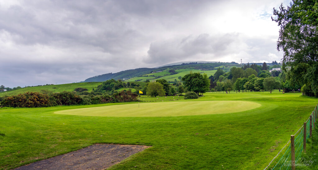 Golf course and hillsides of Northern Ireland displaying the many shades of green