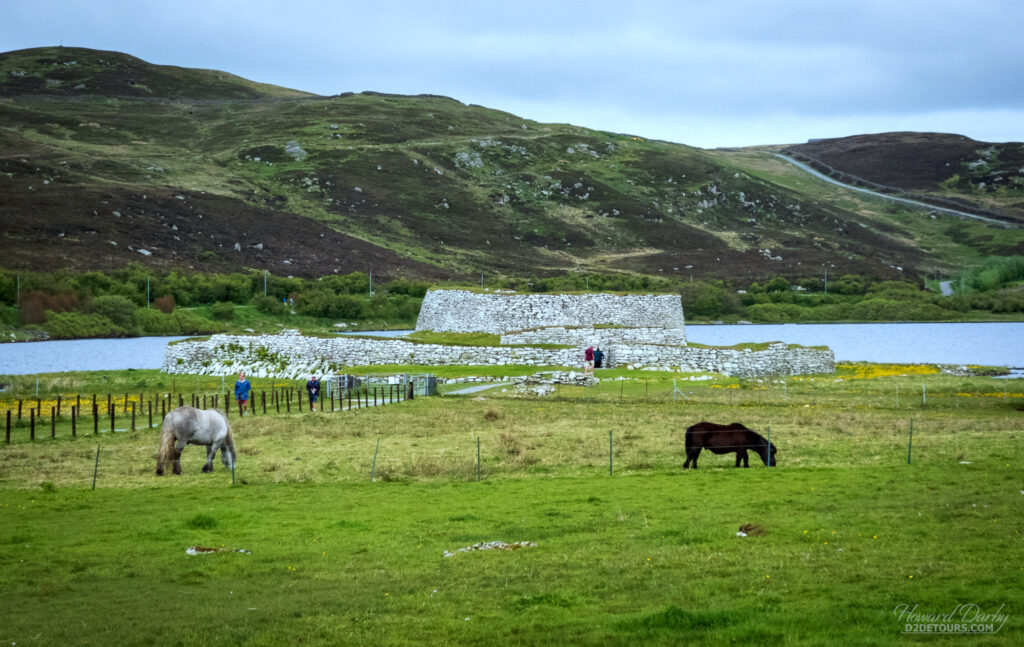 The Broch of Clickimin, a restored roundhouse dating from 400 BC, with the obligatory Shetland Ponies