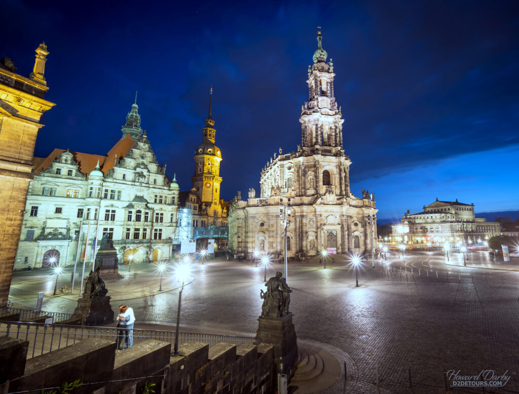 The Schlossplatz - a Cobbled square with 18th-century origins, overlooked by a cathedral & palace that was destroyed and subsequently restored after WWII