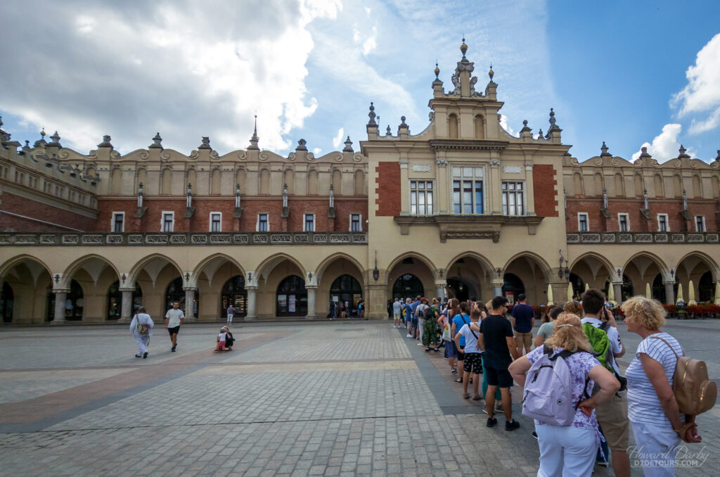 Lining up for the Rynek Underground Museum before the doors open on the weekly free day - they then provide you with a ticket showing the time to return for your visit