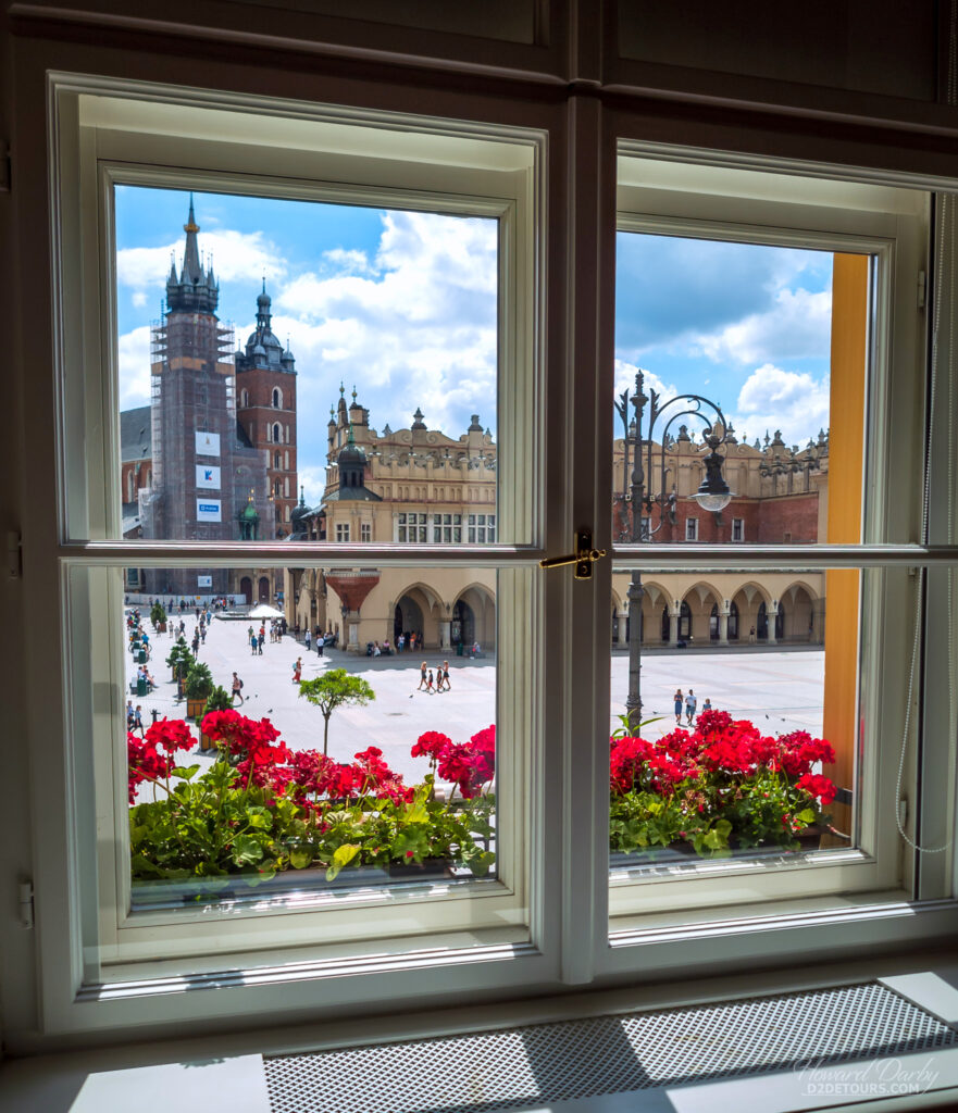 Window in the Krzysztofory Palace looking down on the Krakow town square