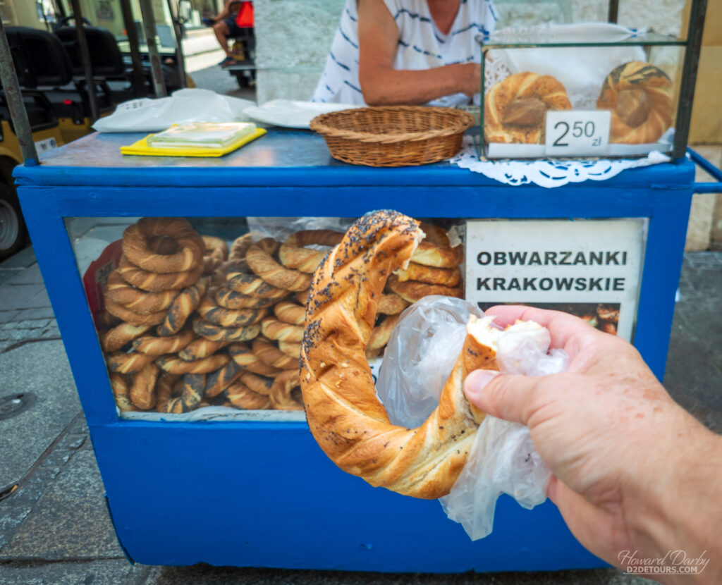 Obwarzanki Krakowskie it a boiled bread sort of like a soft pretzel that's sold from carts all over Poland