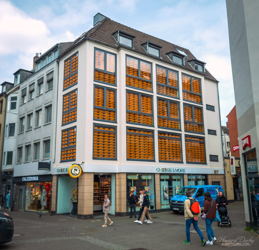 The Cheese & More shop certainly puts its wares on display, with hundreds of wheels of cheese in its windows