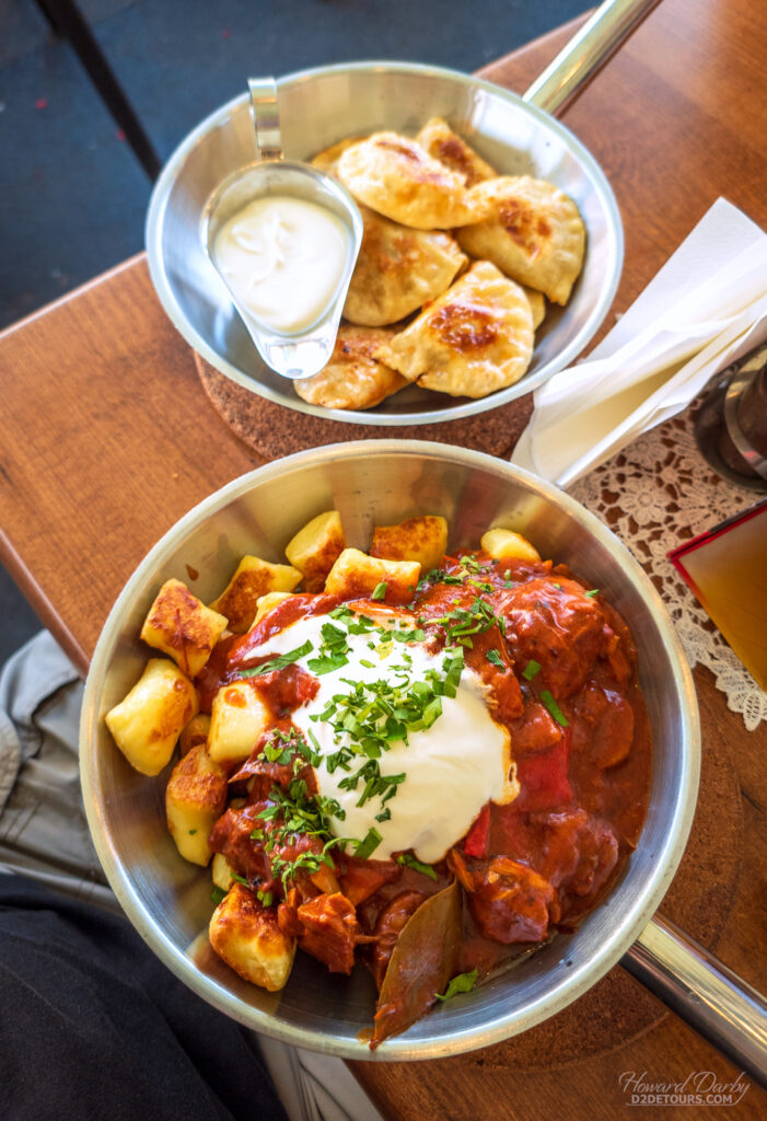 Pierogis (top) and pork stew with potato dumplings