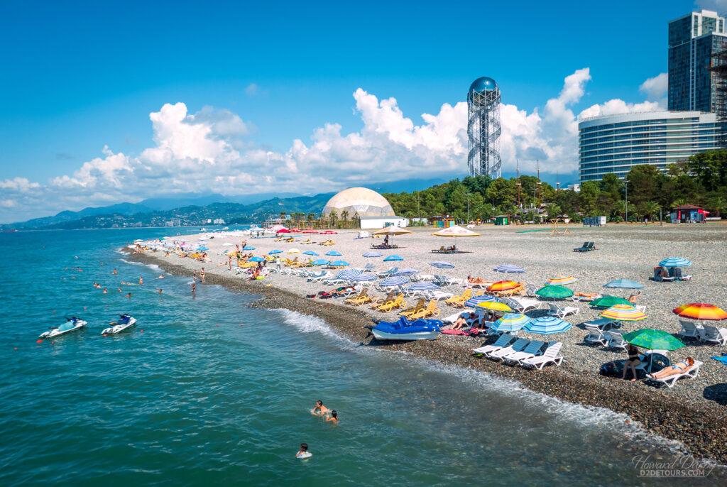 Sunbathers on the rocky Batumi shoreline