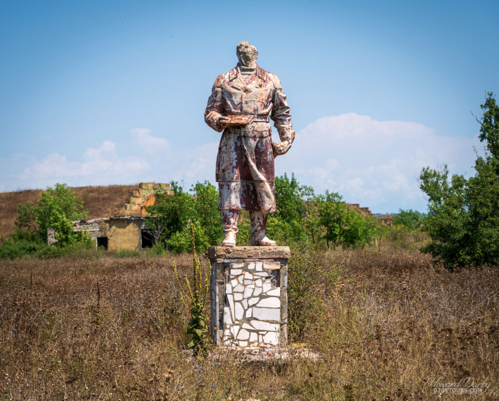 The remnants of a statue on the parade grounds of the airfield